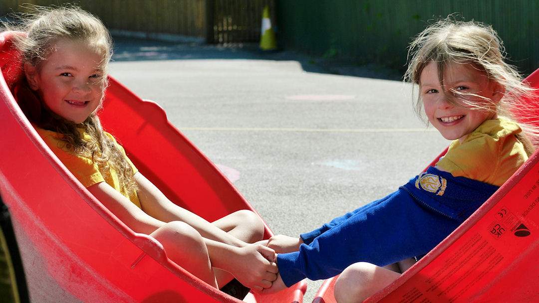 Two children holding hands