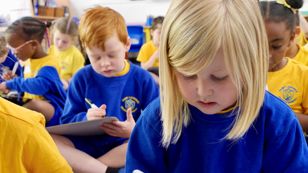 Children sitting working in their classroom